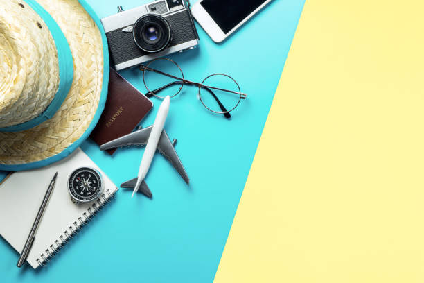 istock Travel accessories objects and gadgets top view flatlay on blue yellow pink 1155270122