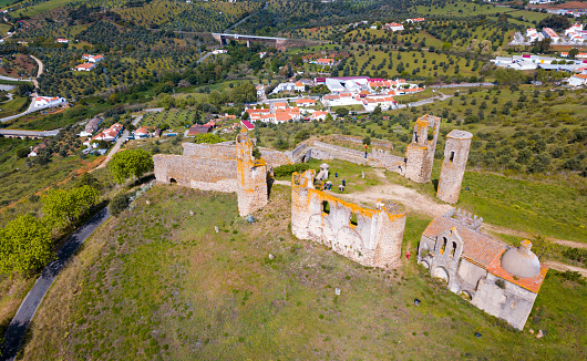 Local landscape of Montemor-o-Novo municipality with ruined medieval castle on hilltop, Portugal