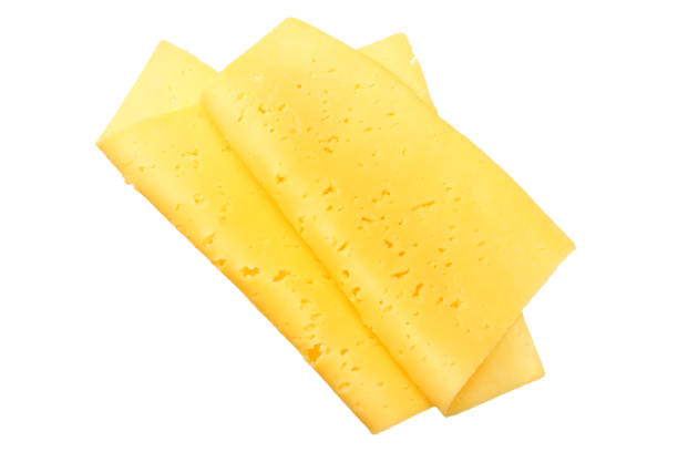 istock cheese slices isolated on white background. top view 1155274364