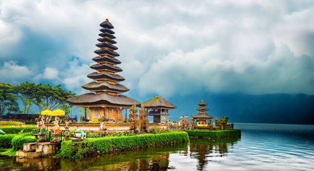 Pura Ulu Danau Temple in Bali on a stormy day panorama Pura Ulu Danau Temple in Bali on a stormy day panorama floating temple in lake bedugul bali stock pictures, royalty-free photos & images