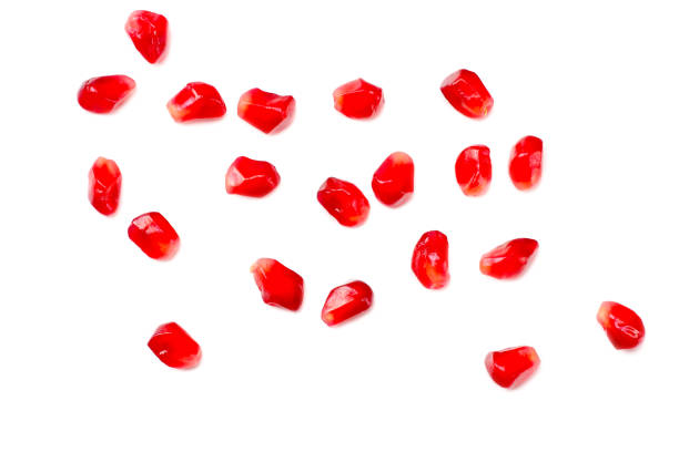 istock pomegranate seeds isolated on white background. top view 1155281151