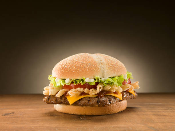 istock Chicken burger on wooden table. 1155283479