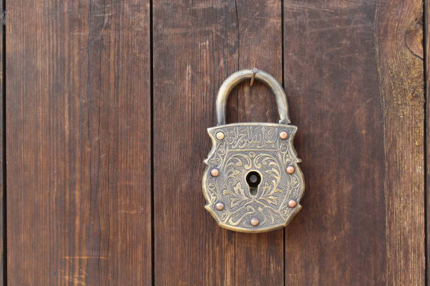 istock Old wooden door and a key 1155283616