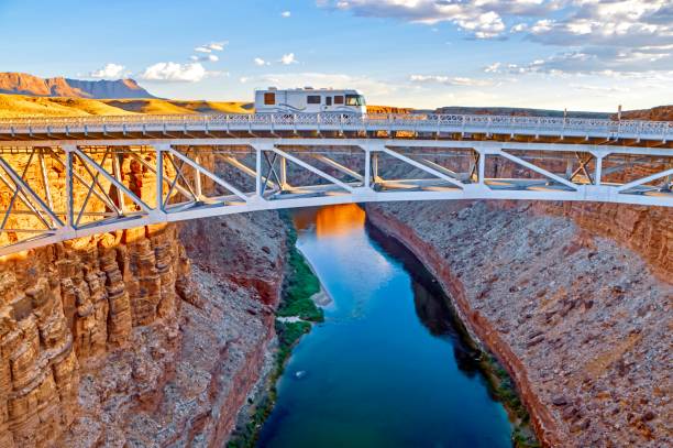 Go West Recreational Vehicle Crossing the Colorado River glen canyon stock pictures, royalty-free photos & images