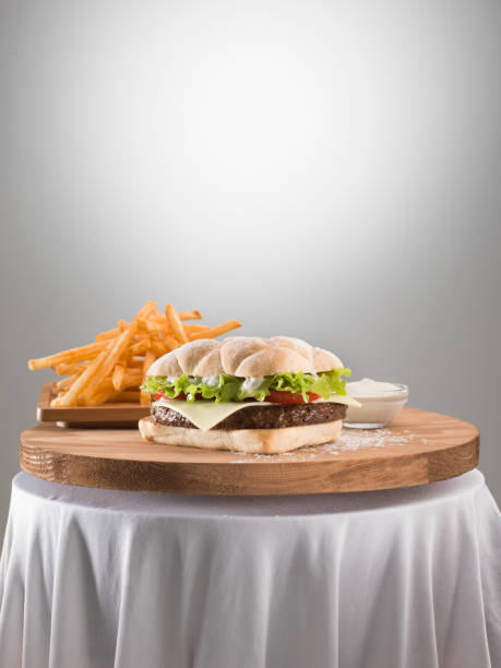 Double Cheese burger on wooden table.
