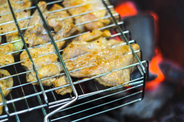 istock Cooking grilled chicken on hot coals. 1155287204