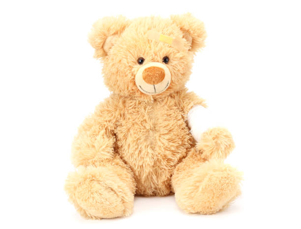 istock toy teddy bear with bandage isolated on white background 1155287283