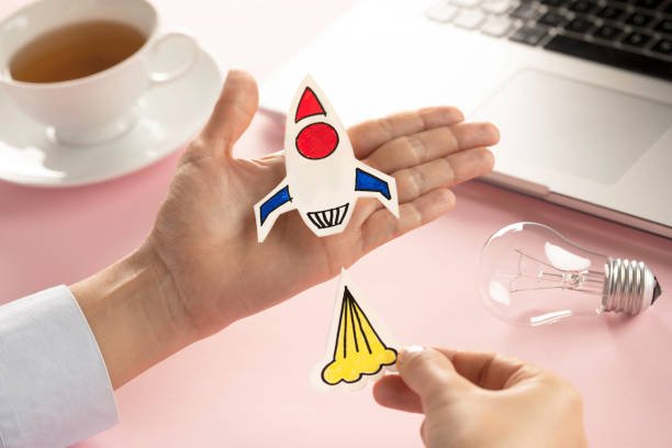 istock Business Person with Startup Rocket 1155287496