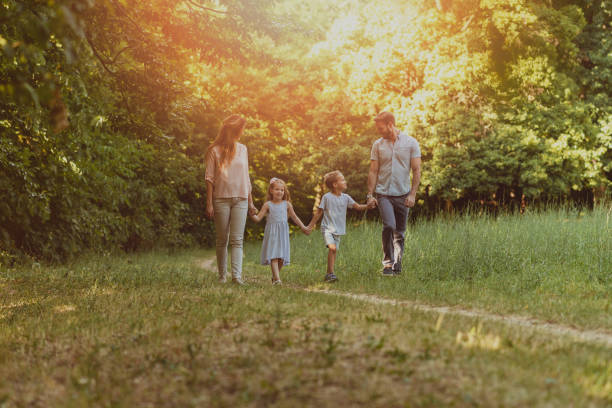 istock Family enjoying beutiful summer day in nature 1155287534