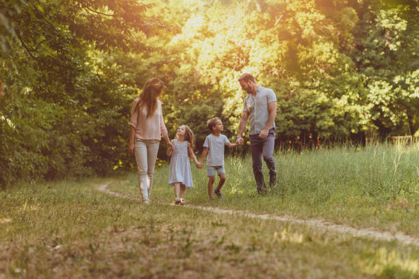 istock Family enjoying beutiful summer day in nature 1155287536