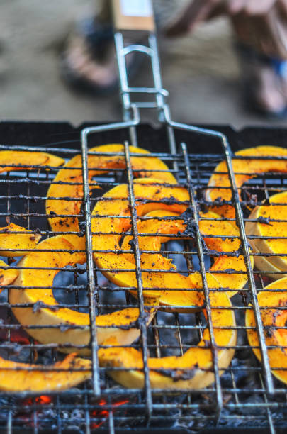 istock Baked pumpkin slices on the grill grid. 1155287768