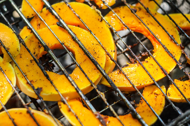 istock Baked pumpkin slices on the grill grid. 1155287826