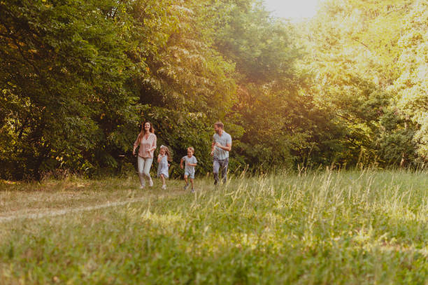 istock Family enjoying beutiful summer day in nature 1155289057
