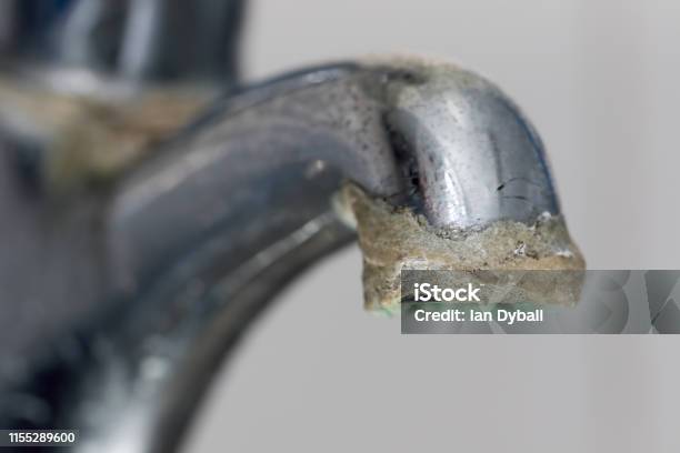 Closeup Of Limescale Buildup Selective Focus On Hard Water Deposit Stock Photo - Download Image Now