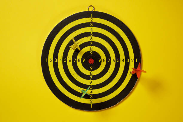 istock Yellow, red and green arrows darts hitting the target dartboard 1155291185