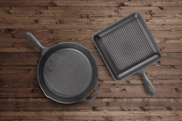 Cast iron frying pan on a wood background