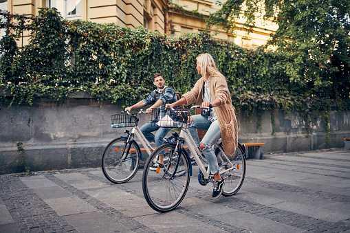 Friends riding bicycles in the city.