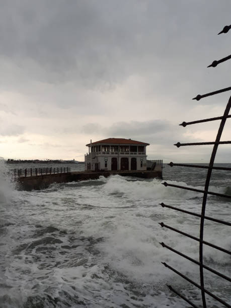 istock Dark turbulent sea waves in the evening 1155292131