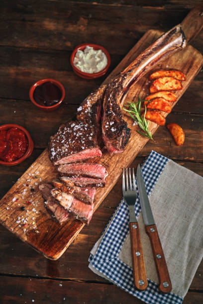 istock Tomahawk Steak with Country Potatoes 1155292325