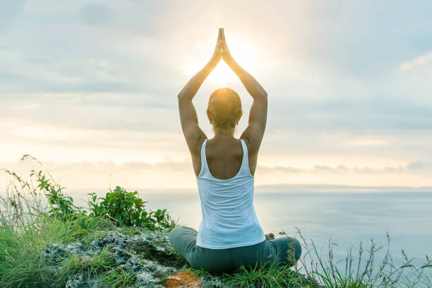 istock Caucasian woman practicing yoga at seashore 1155292441