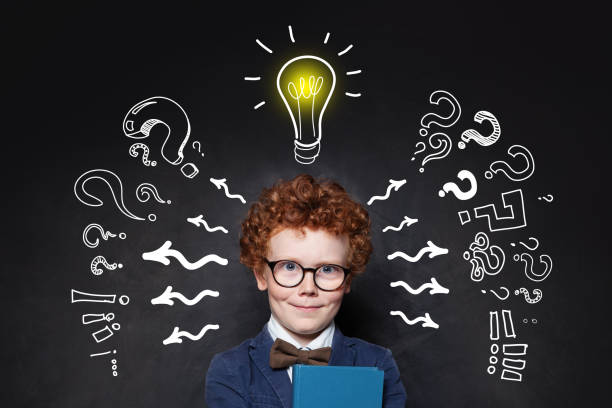 istock Smiling kid and lightbulb. Brainstorming and idea concept 1155294367
