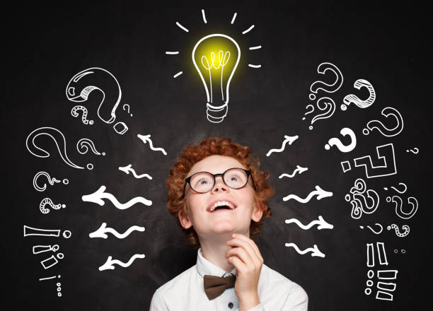 istock Funny child boy student with lightbulb. Brainstorming and idea concept 1155294394