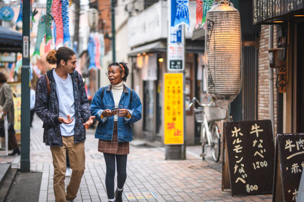 istock Young and Carefree Mixed-Ethnic Couple Exploring Tokyo 1155295706