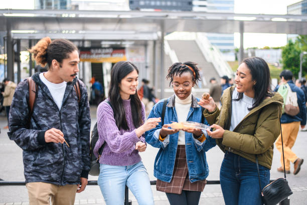 istock Young Mixed-Ethnic Group Enjoying Outdoor Snack in Tokyo 1155295748