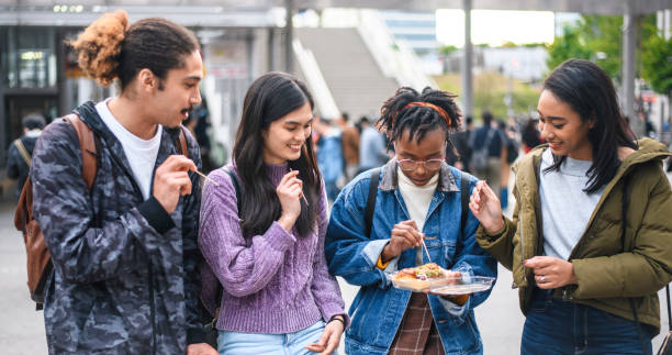istock Young Mixed-Ethnic Group Enjoying Outdoor Snack in Tokyo 1155295750