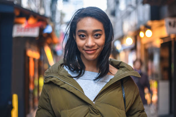 istock Smiling Young Mixed Race Woman Exploring Tokyo 1155295753