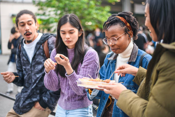 istock Young Mixed-Ethnic Group Enjoying Outdoor Snack in Tokyo 1155295856