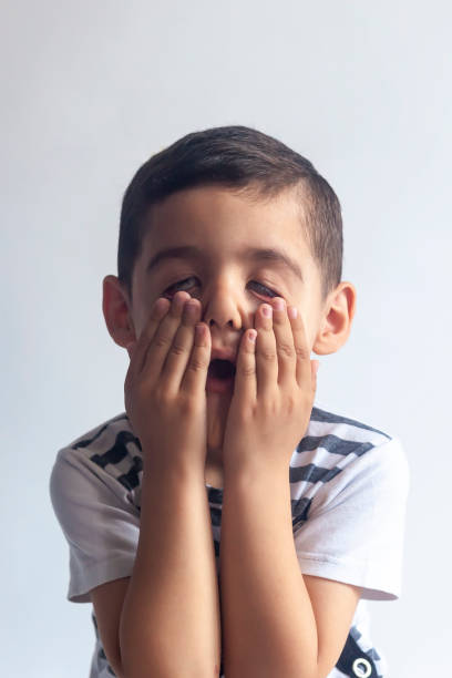 istock Happy childhood. Little boy making funny face 1155296837