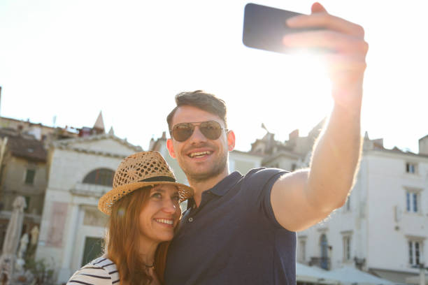 istock Tourists in a new city taking selfie 1155303759