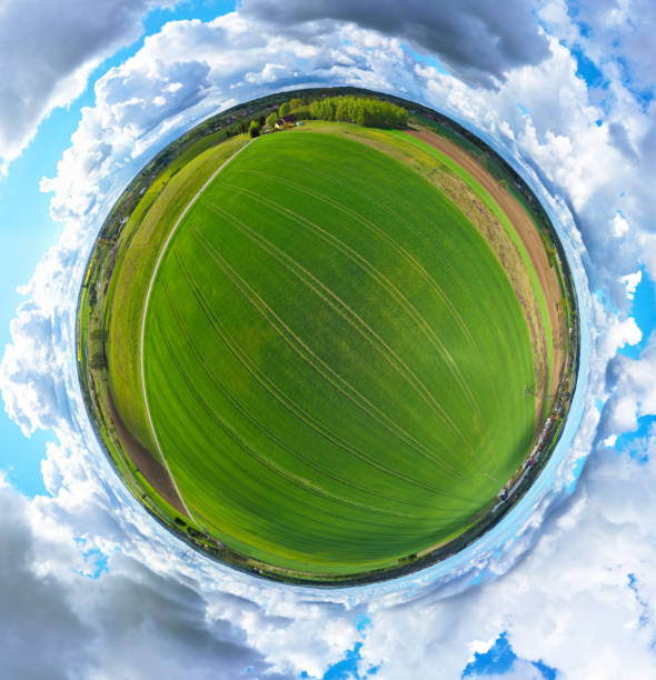 istock Aerial 360 degree panoramic view on rural landscape with house, forest, clouds and fields 1155304601