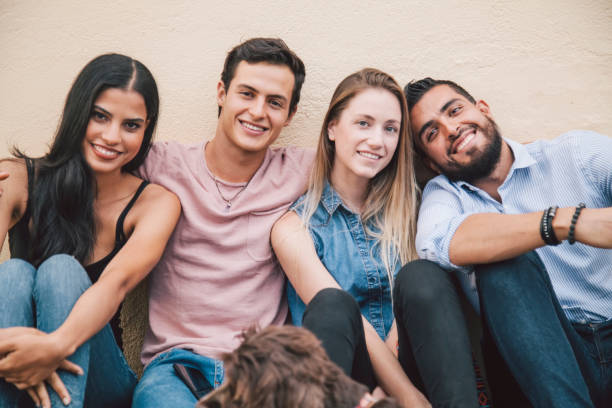 istock Diverse young and cute friends smiling at camera 1155305604