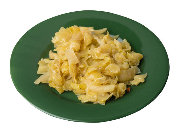 istock braised cabbage in plate isolated on white background.  cabbage top view 1155311126