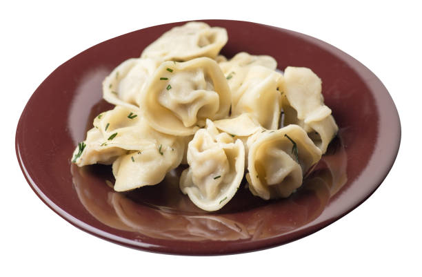 istock dumplings on a plate isolated on white background .meat dumplings top view . 1155312019