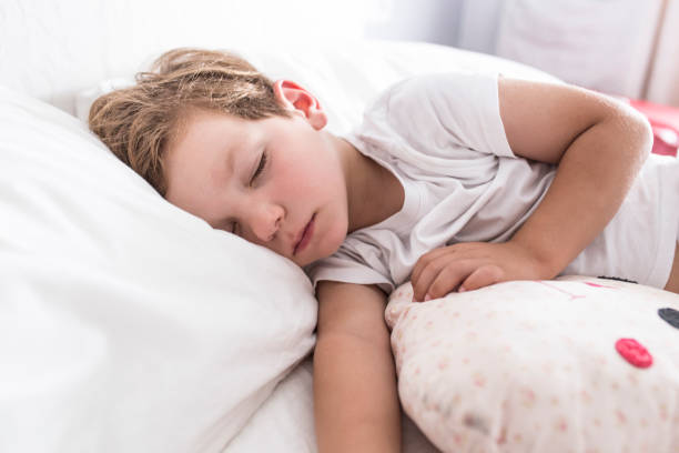 istock 3 years toddler boy sleeping the siesta on bed 1155313734