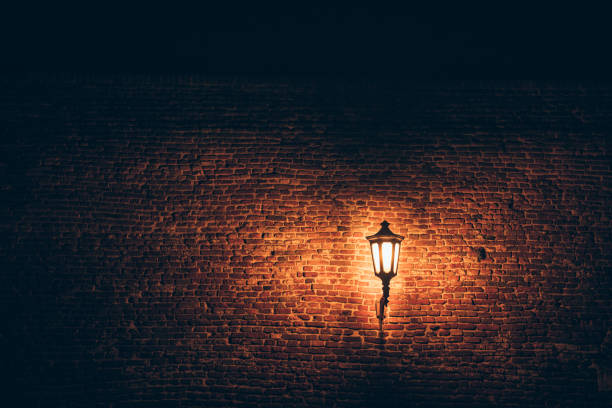 istock Street light on a brick wall 1155316864