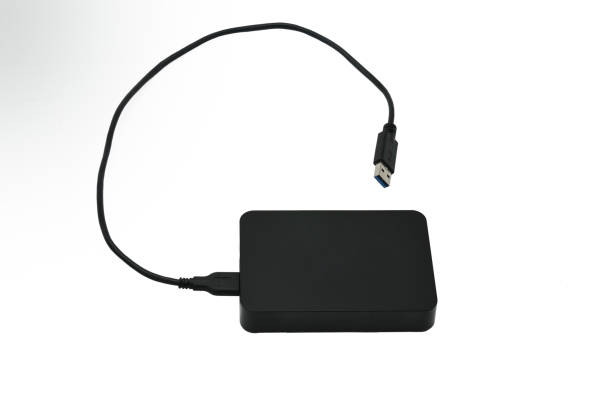 istock External hard drive for storing and transferring various files on a white background 1155320158