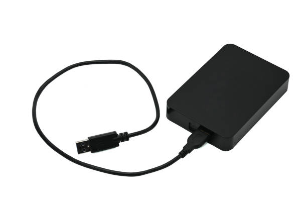 istock External hard drive for storing and transferring various files on a white background 1155320167