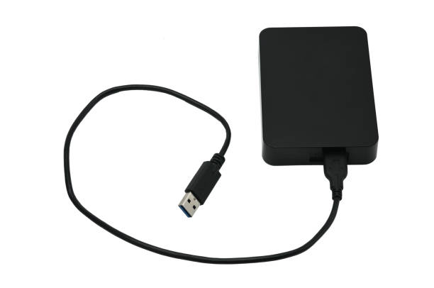 istock External hard drive for storing and transferring various files on a white background 1155320217