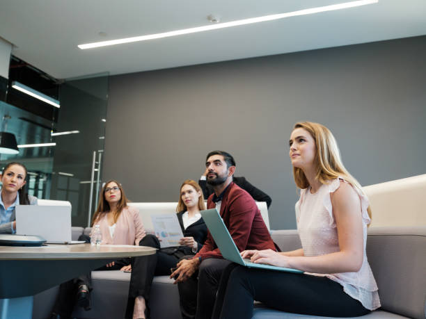 istock Handsome business people in a meeting 1155328081