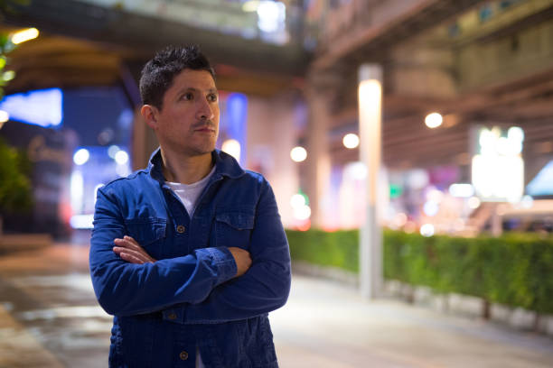 Man using a cell phone at night
