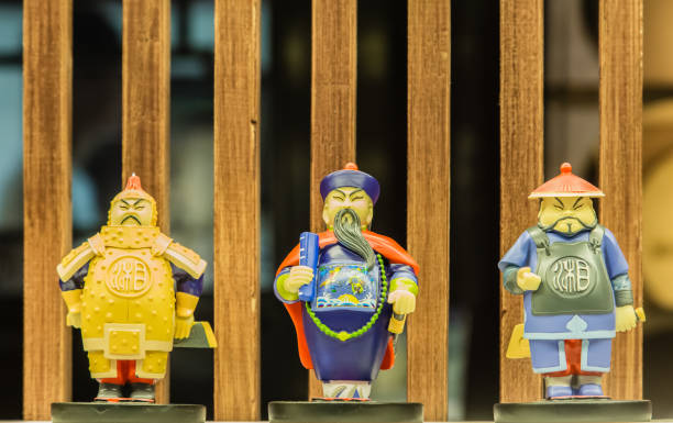 Rows of colorful porcelain figurines of Mao and Communist soldiers in an antique market in Shanghai, China. 