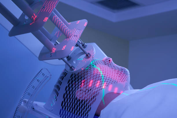 Man Receiving Electron Radiation (Radiotherapy) for Cancer Treatment stock photo