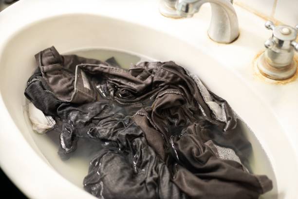 istock Clothes washing in the sink 1155335410
