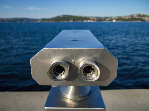 istock Watching beautiful landscape with binoculars from coast side 1155338797