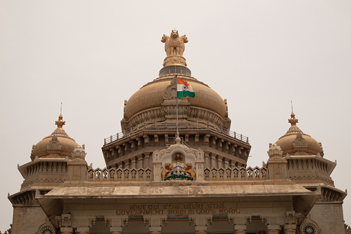 Indian Flag waving on the dome of Vidhana Soudha at Bangaluru, India.