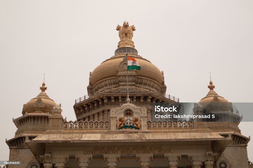 Indian Flag waving on the dome of Vidhana Soudha at Bangaluru, India Indian Flag waving on the dome of Vidhana Soudha at Bangaluru, India. Flag Stock Photo